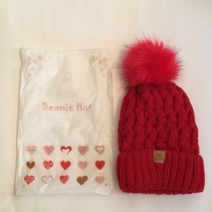 New Page One Beanie Hat, Red Color, with furry ball.